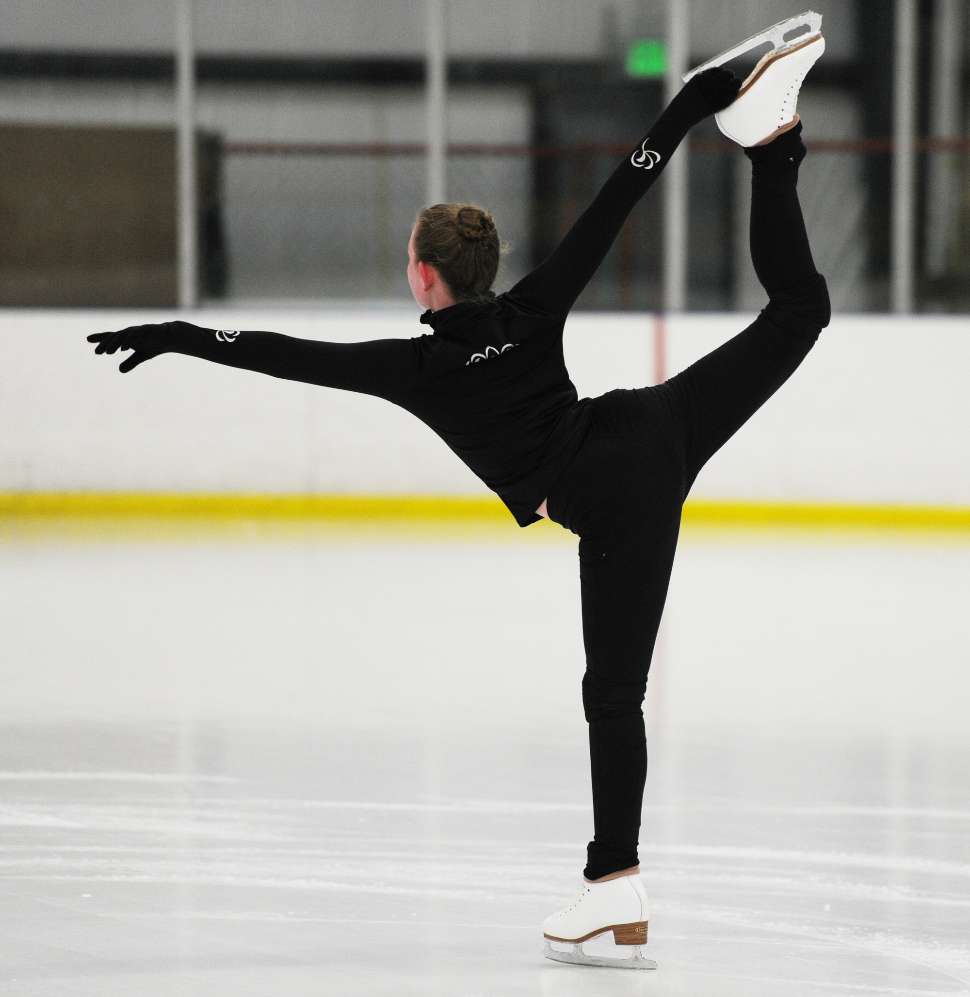 skater performing a catch foot spiral
